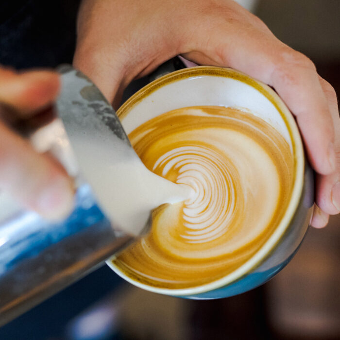 pouring milk for coffee